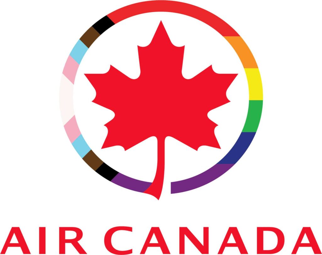 Air Canada pride logo. This image has a white background. A red maple leaf is at the center of the image with a thin circle around it. This circle is a cutout from the progress pride flag such that the rainbow colours and the triangle on the left side of the flag representing trans and BIPOC folk are visible. The bottom has the words Air Canada in red.